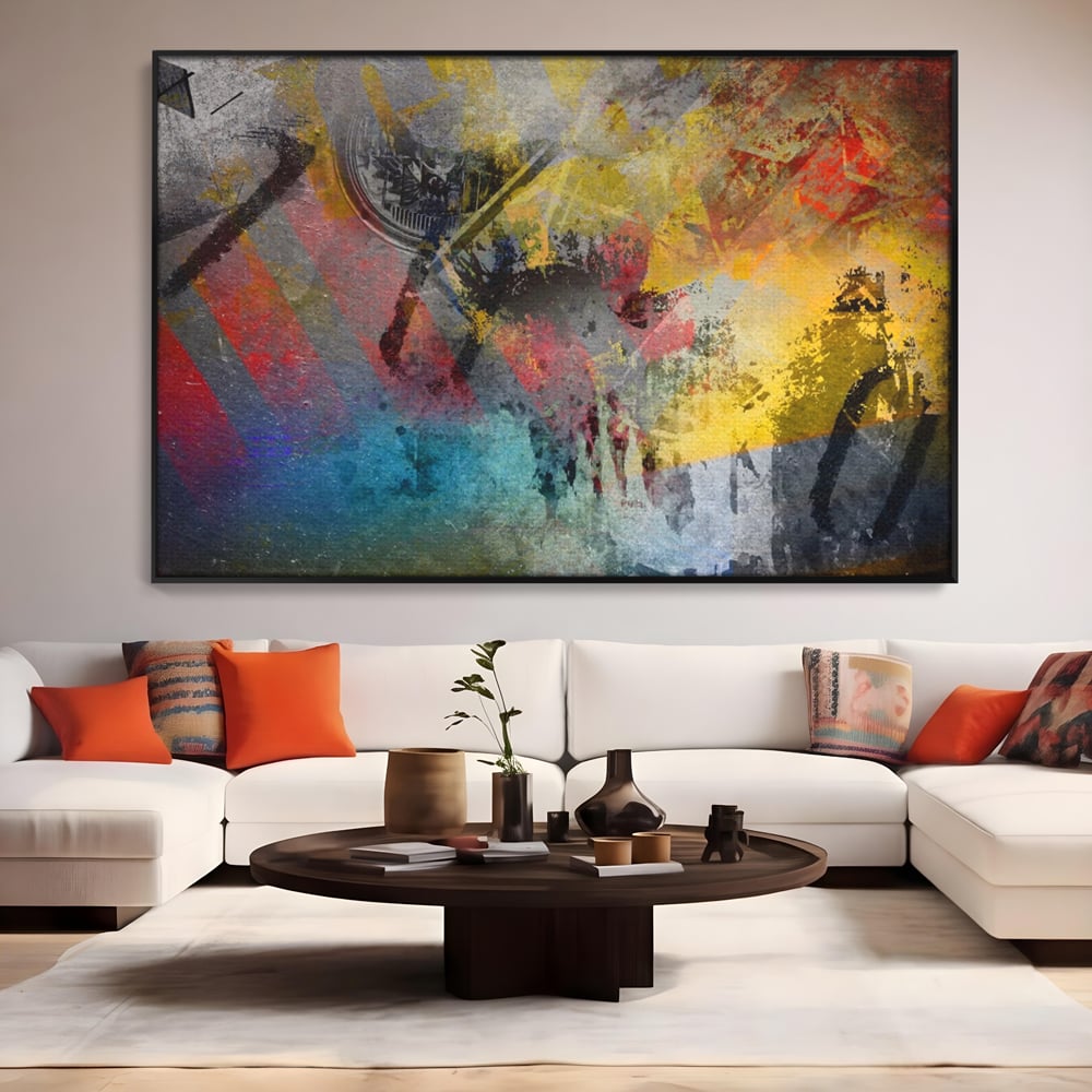 Tablou canvas cu pictura abstracta cu pete vibrante, in rama de aluminiu negru, pe perete intr-un living